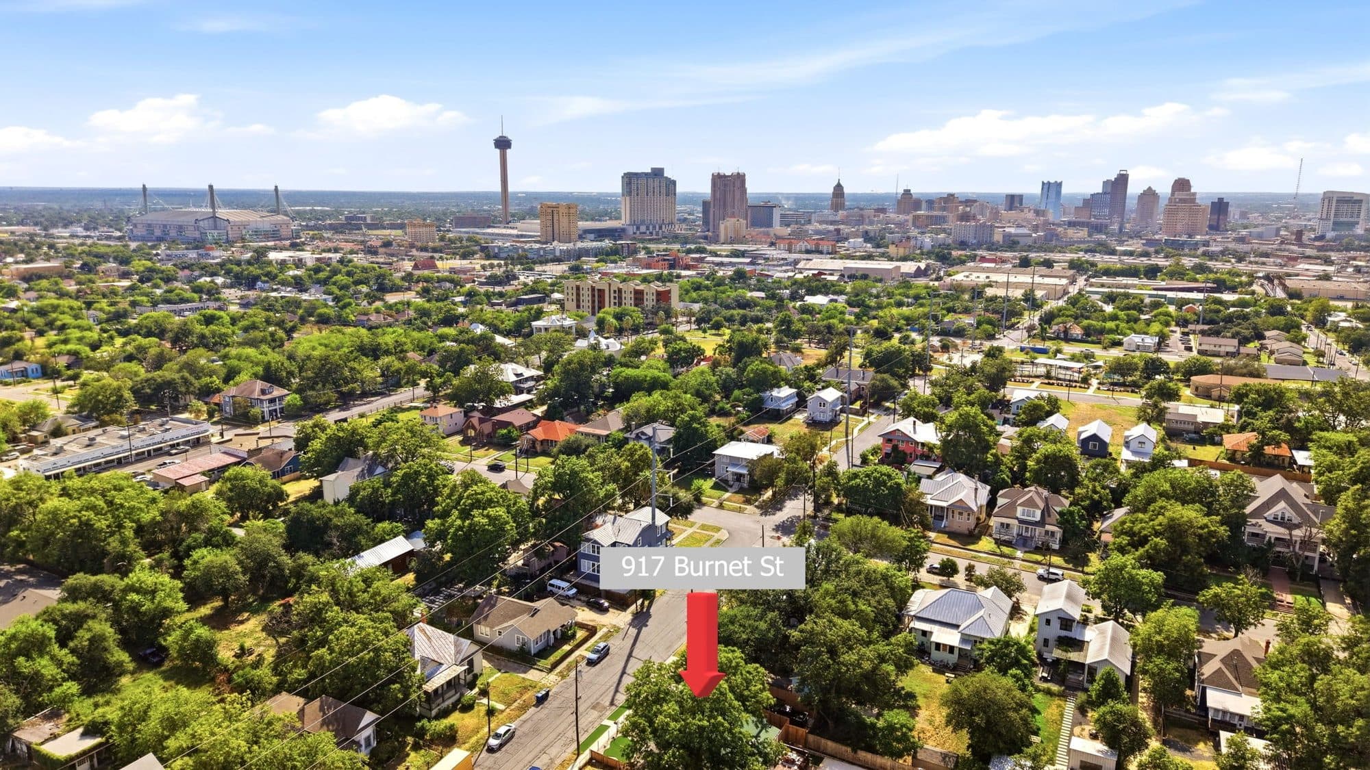 Aerial view of 917 Burnet Street with the downtown San Antonio skyline