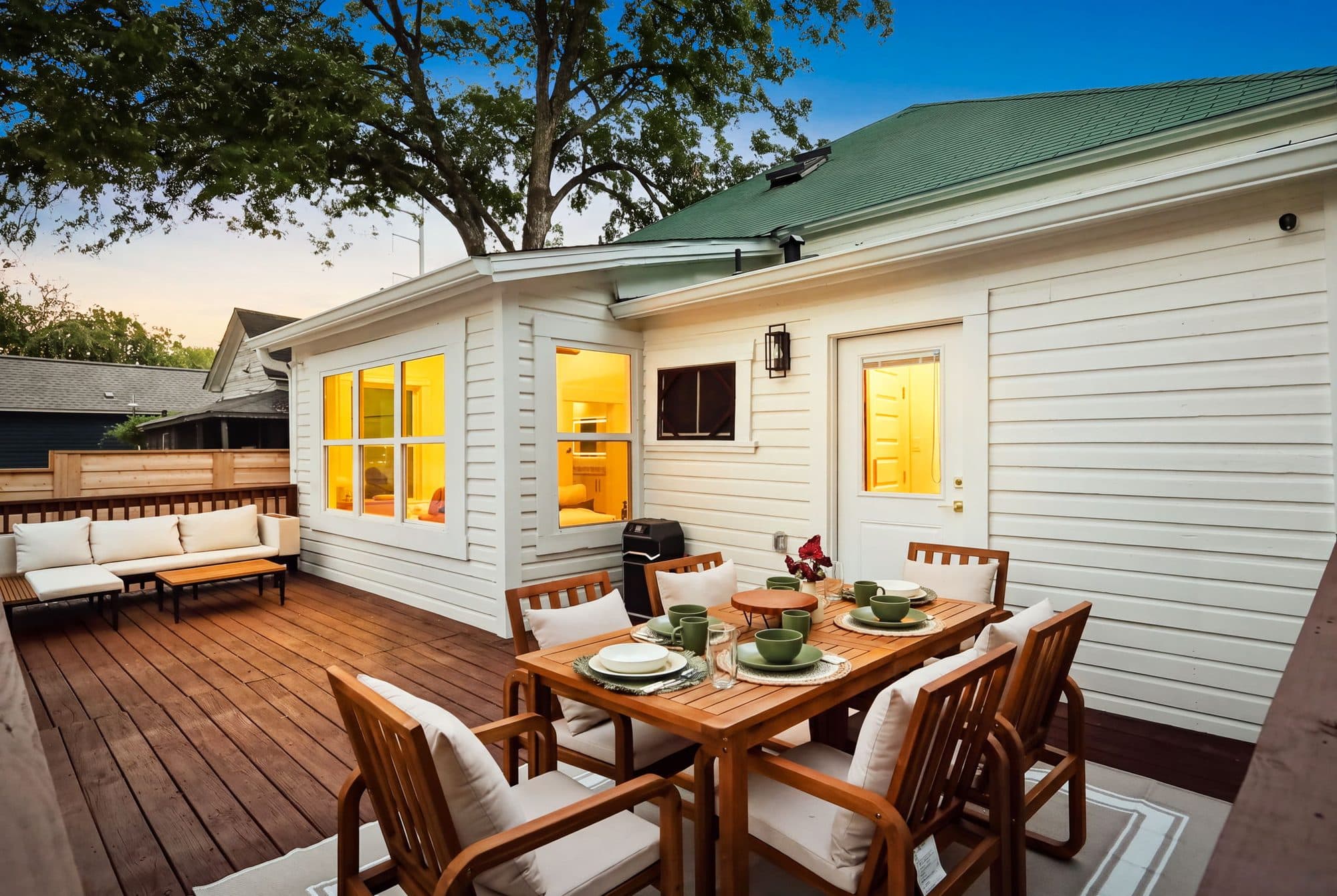 Back deck and outdoor dining at 917 Burnet Street in the evening