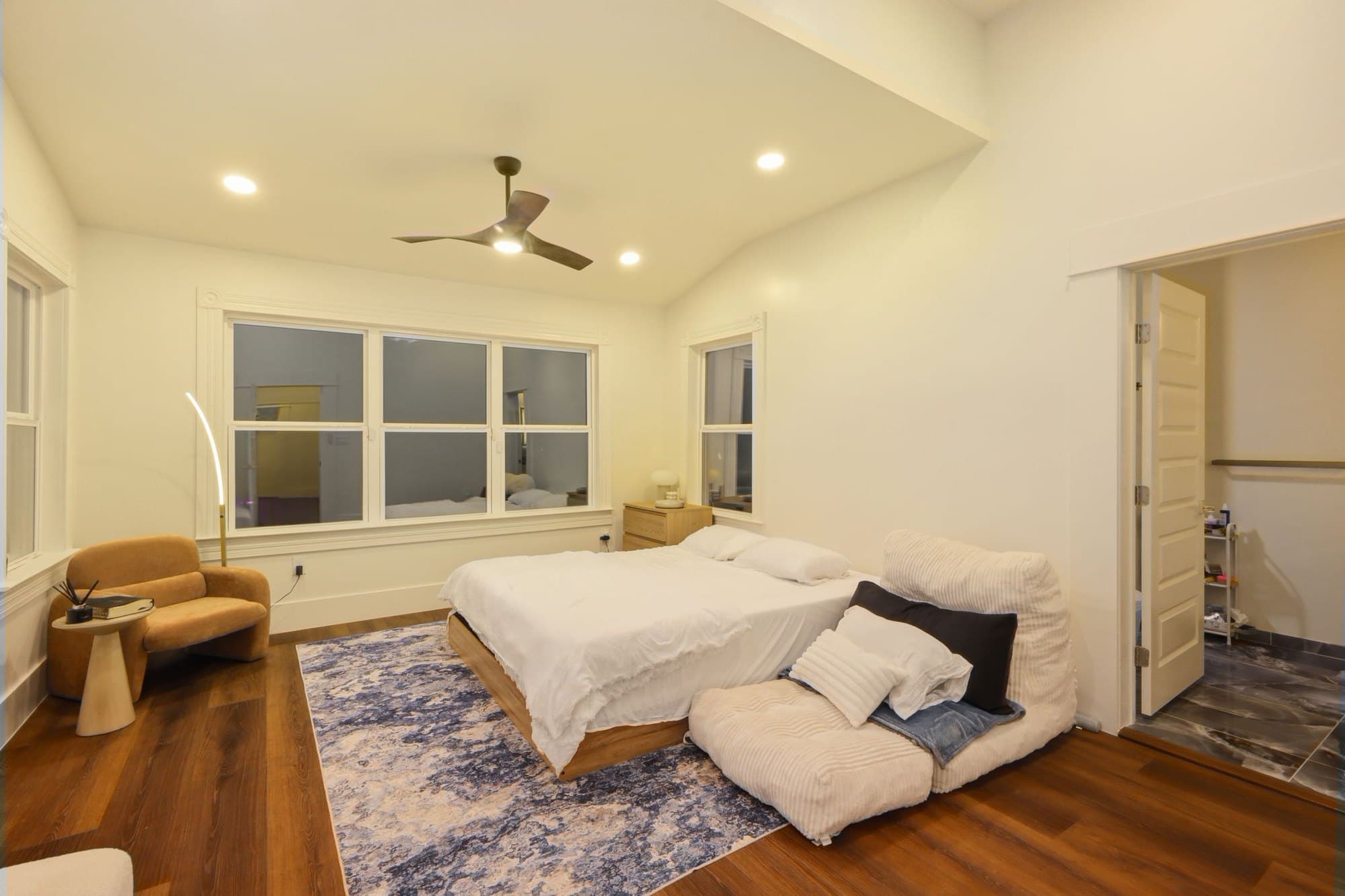 Second bedroom with vaulted ceiling and oak flooring